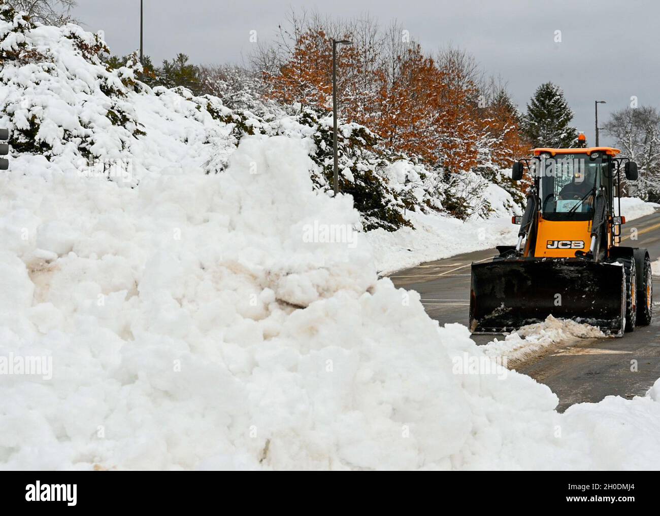 Curtis Feltus, 66th Civil Engineering Division Roads and Grounds operator, moves snow following a winter storm that impacted the region and Hanscom Air Force Base, Mass., Feb. 3. The base and surrounding areas saw more than a foot of snow this week as a result of the snowstorm. Stock Photo