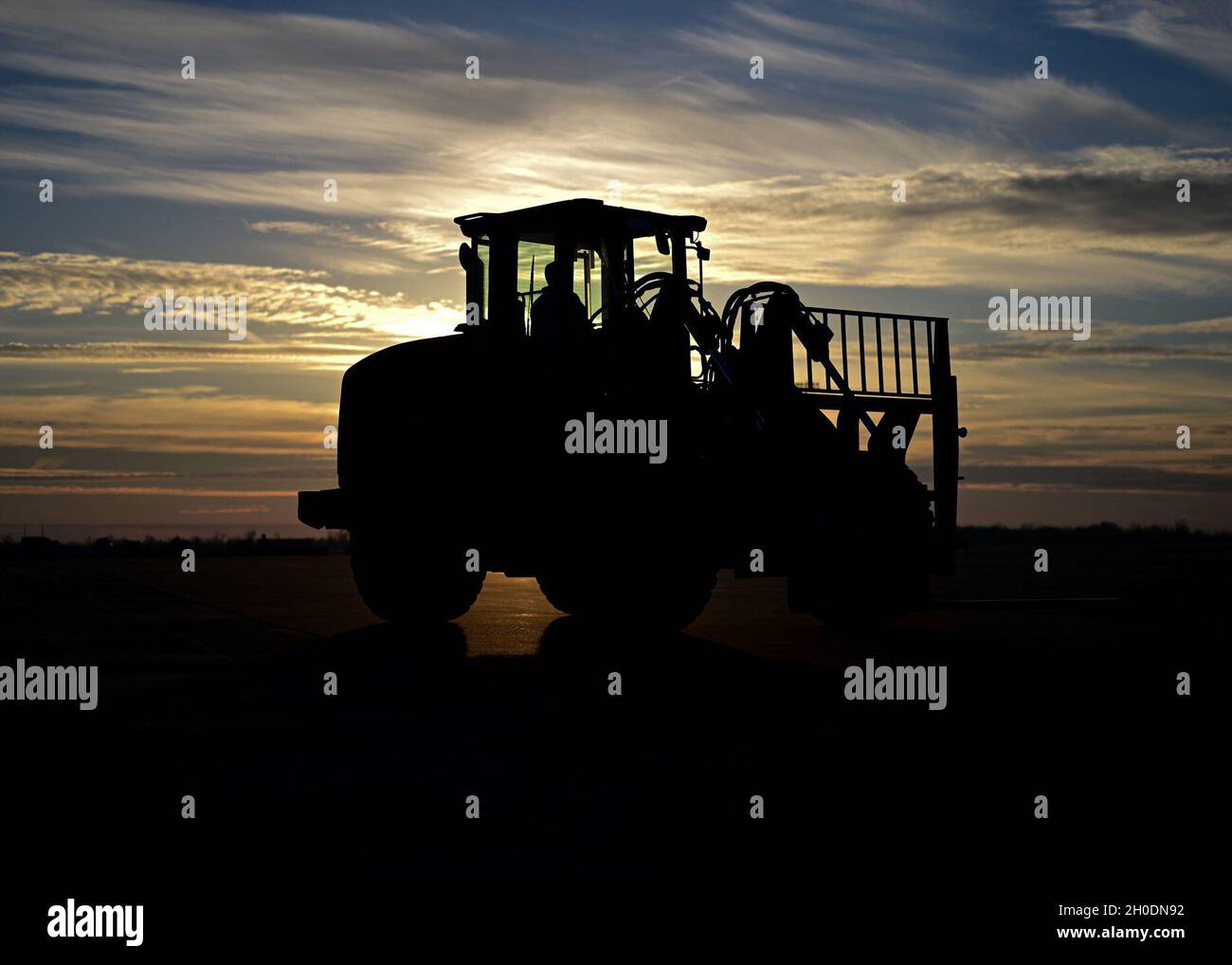 An Airman operates a forklift on the flightline during Green Flag Little Rock 21-04 at Alexandria International Airport, Louisiana, Feb. 3, 2021. As Air Mobility Command’s only joint-accredited flag-level exercise, GFLR offers unit participants a fluid training syllabus with each exercise tailored to meet unit specific requirements and certain major command designated training. Stock Photo