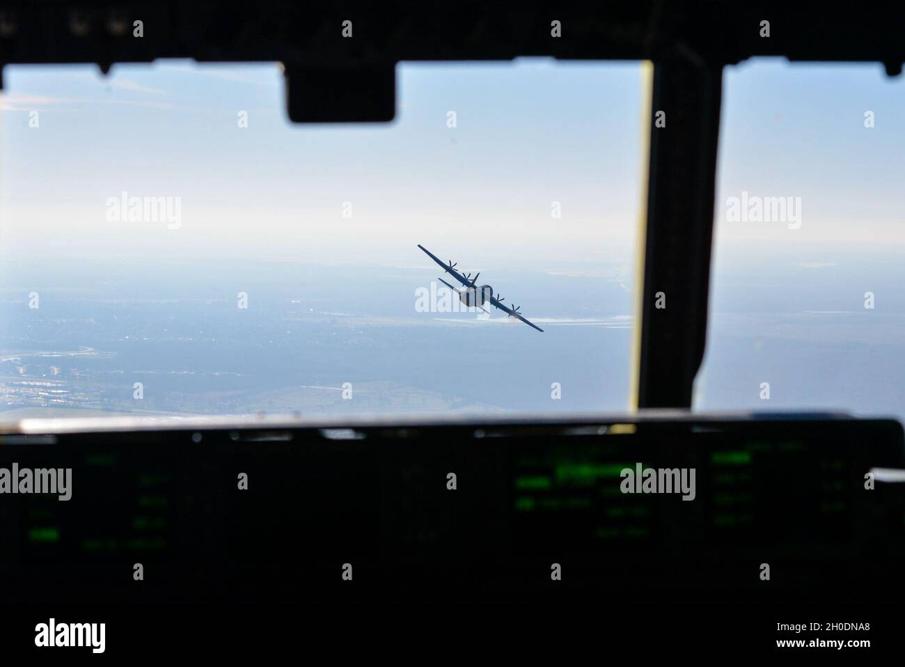 A C-130J Super Hercules flies over Alexandria, Louisiana during Green Flag Little Rock 21-04, Feb. 3, 2021. As Air Mobility Command’s only joint-accredited flag-level exercise, GFLR offers unit participants a fluid training syllabus with each exercise tailored to meet unit specific requirements and certain major command designated training. Stock Photo