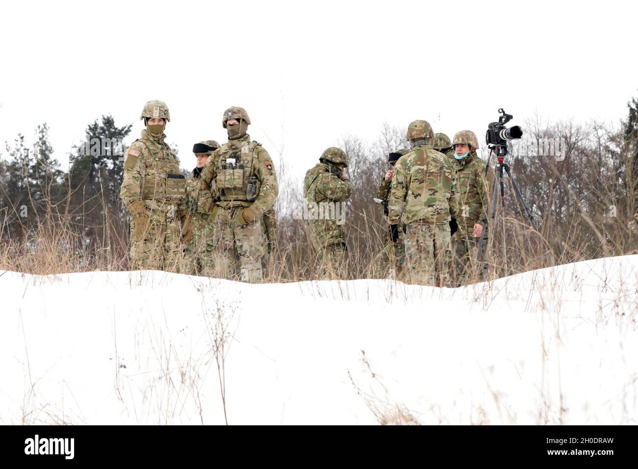 U.S. Army Soldiers from 1st Squadron, 2d Cavalry Regiment and Croatian Army Troops from 17th Contingent, Volcano Battery, enhanced Forward Presence Battle Group Poland stand on a range during a live fire event February 4, 2021, at Bemowo Piskie Training Area, Poland. Stock Photo
