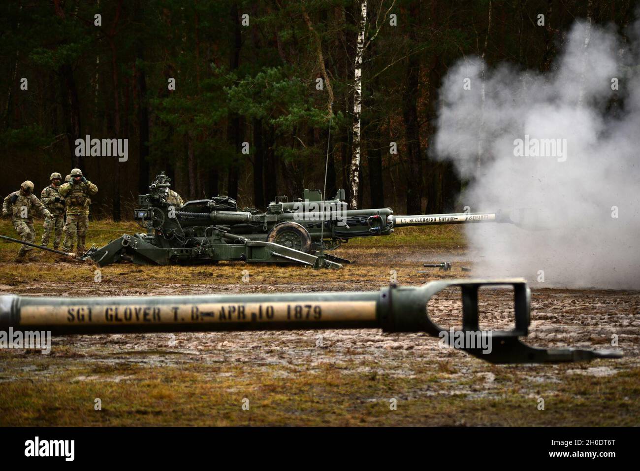 U.S. Soldiers assigned to Cobra Battery, Field Artillery Squadron, 2nd Cavalry Regiment, conduct a direct fire exercise with M777 Howitzers, Grafenwoehr Training Area in Bavaria, Germany, Feb. 4, 2021. Stock Photo