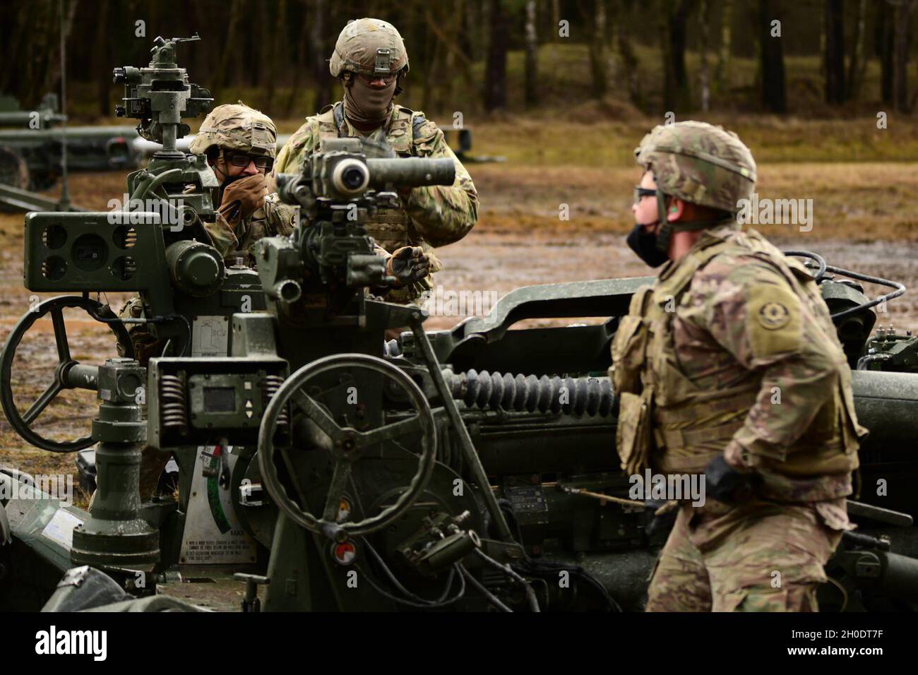 U.S. Soldiers assigned to Cobra Battery, Field Artillery Squadron, 2nd Cavalry Regiment, conduct a direct fire exercise with M777 Howitzers, Grafenwoehr Training Area in Bavaria, Germany, Feb. 04 2021. Stock Photo