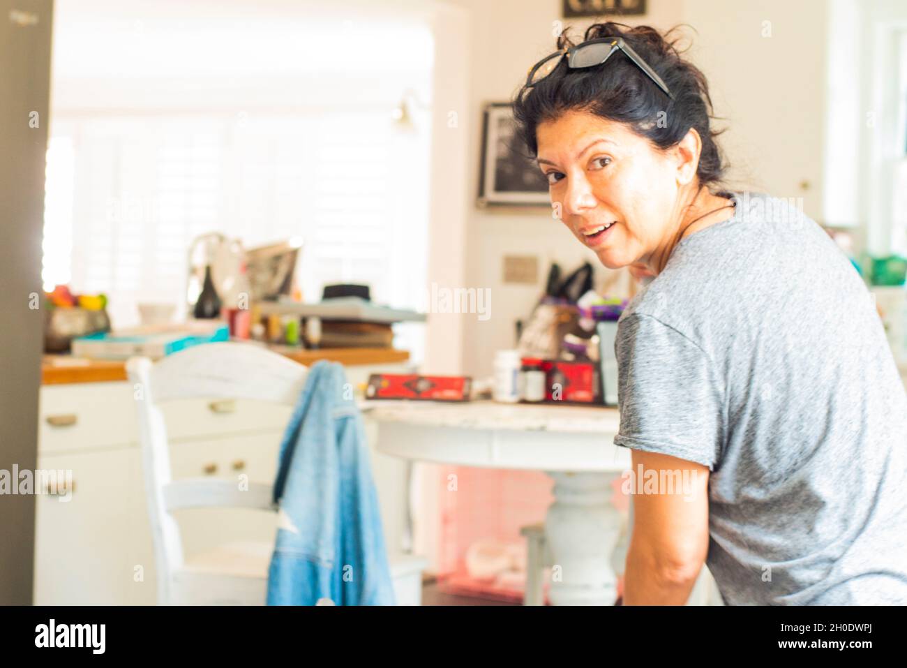Latin woman cleaning The kitchen Stock Photo