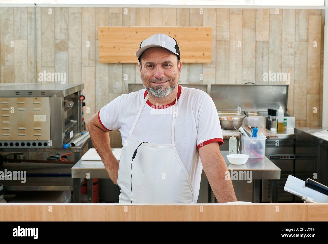 Small restaurant owner looks at the camera Stock Photo