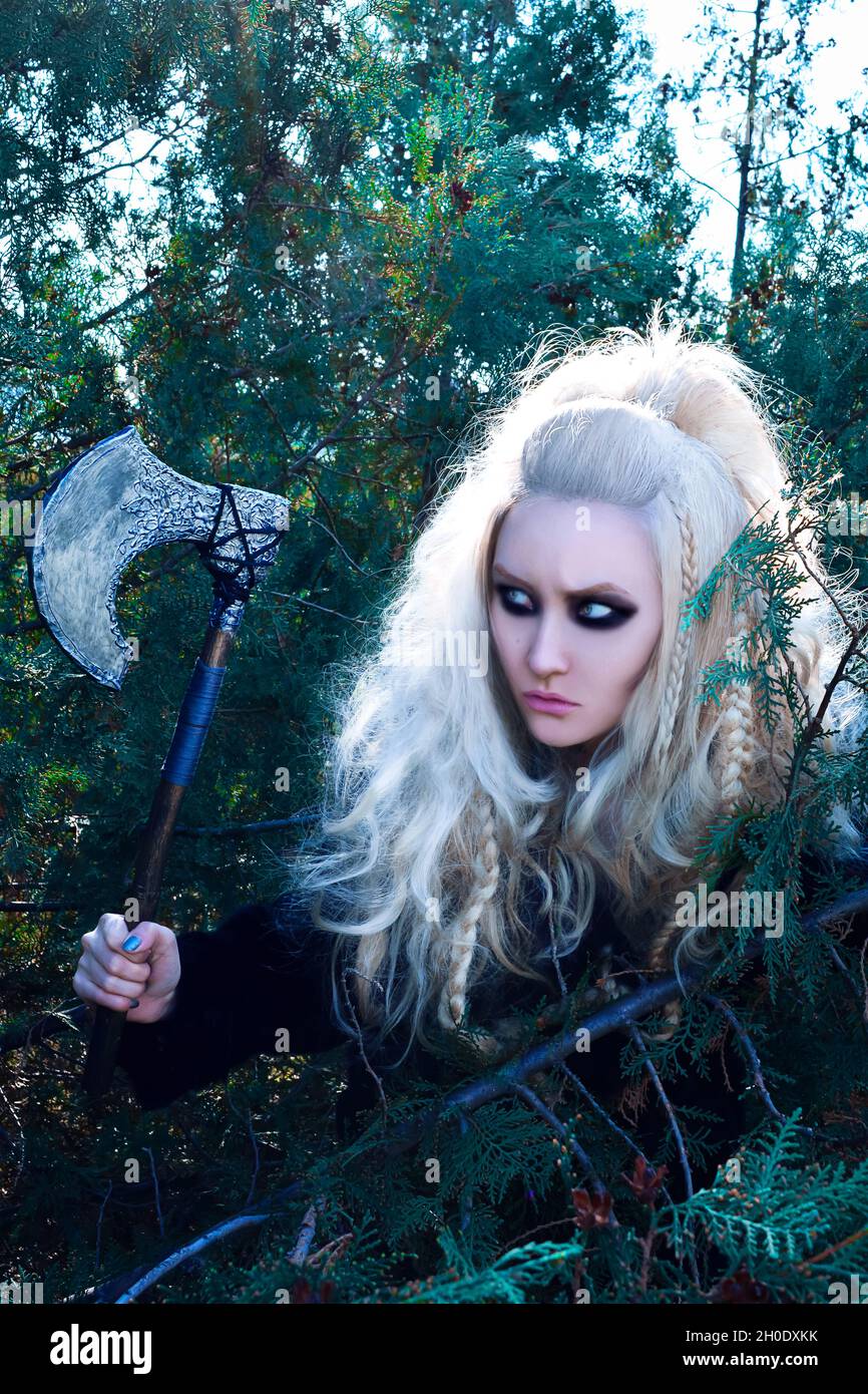 Viking Girl with metal axe Stock Photo - Alamy