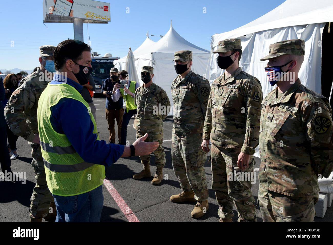 Arizona Governor Doug Ducey, met with and thanked Arizona National Guard soldiers who are assisting staff and volunteers at a state run, Federal Emergency Management Agency supported, COVID-19 vaccination distribution facility in Glendale, Ariz., Feb. 05, 2021. The governor and other VIPs visited the pharmacy, where the vaccinations are stored and syringes are filled, as well as all stages of the drive-through vaccination distribution site. (U .S. Air Stock Photo