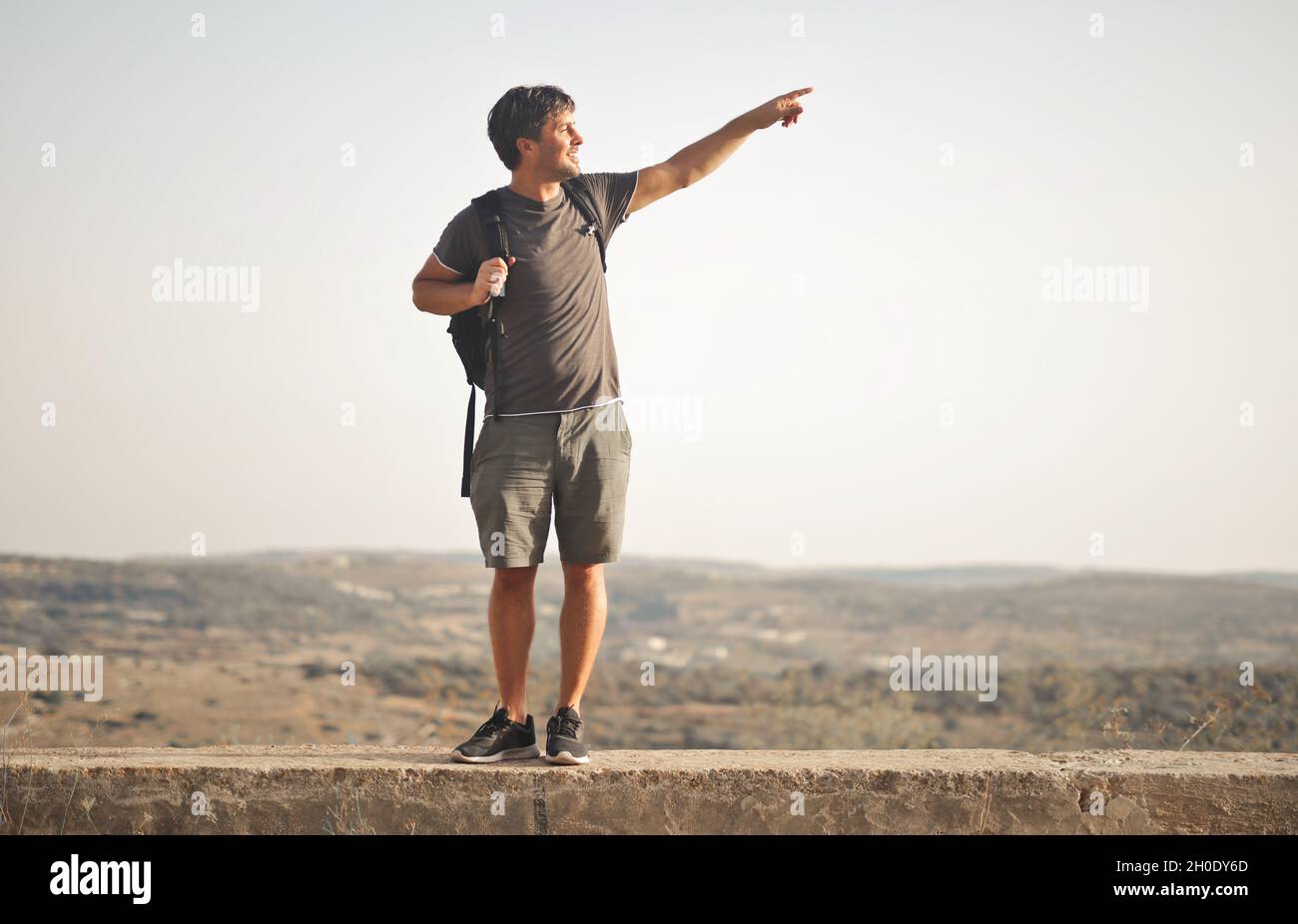 young man with backpack traveling Stock Photo