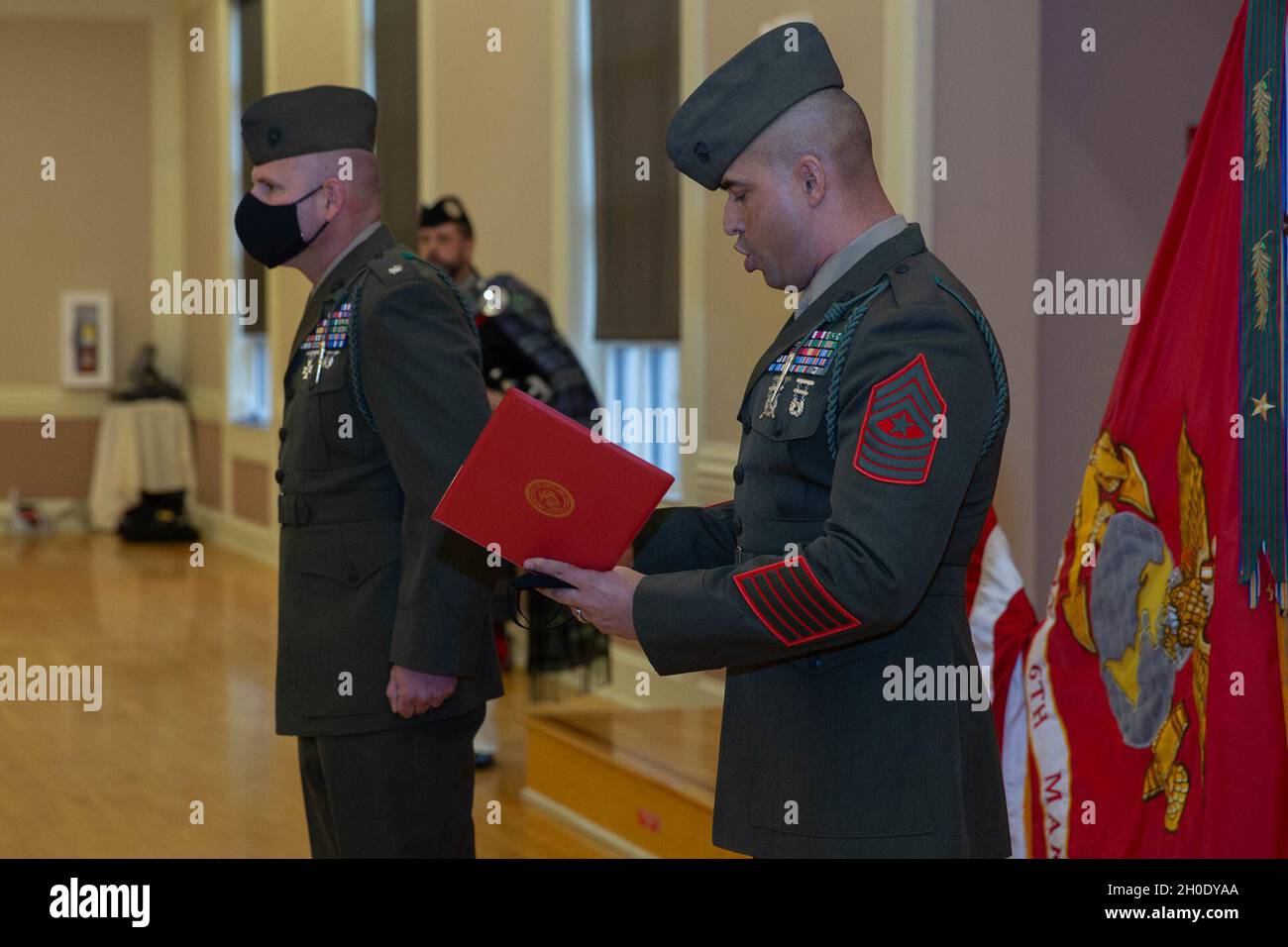 U.S. Marine Corps Sgt. Maj. Jose Acero, the battalion sergeant major of 2d  Battalion, 6th Marine Regiment, 2d Marine Division, reads the French  Fourragere citation on Camp Lejeune, N.C., Feb. 5, 2021.