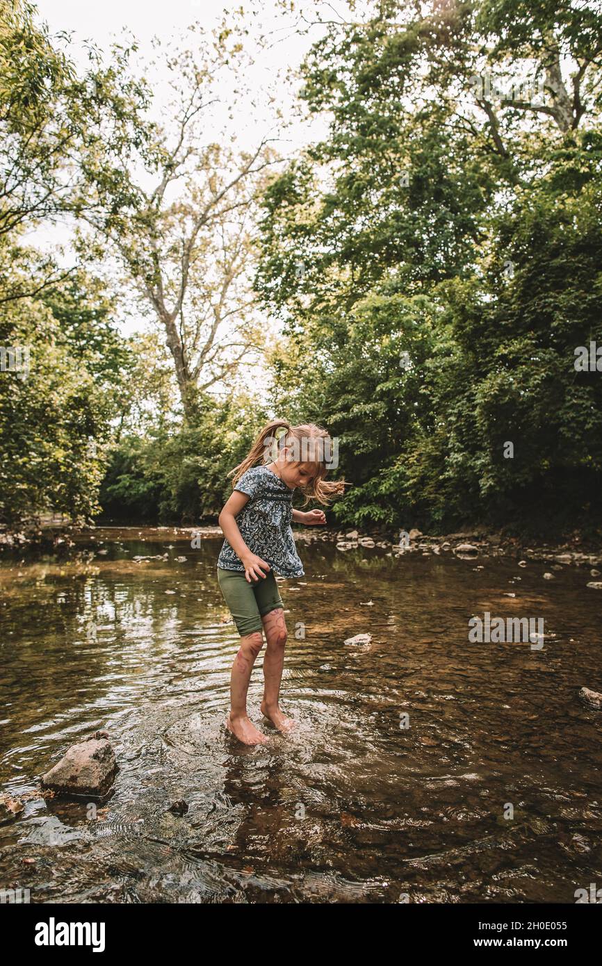 splashing in the creek in the summer Stock Photo