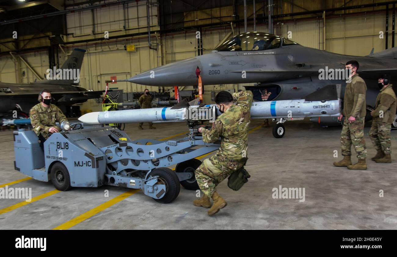 Airmen from the 35th Aircraft Maintenance Unit weapons load crew ...