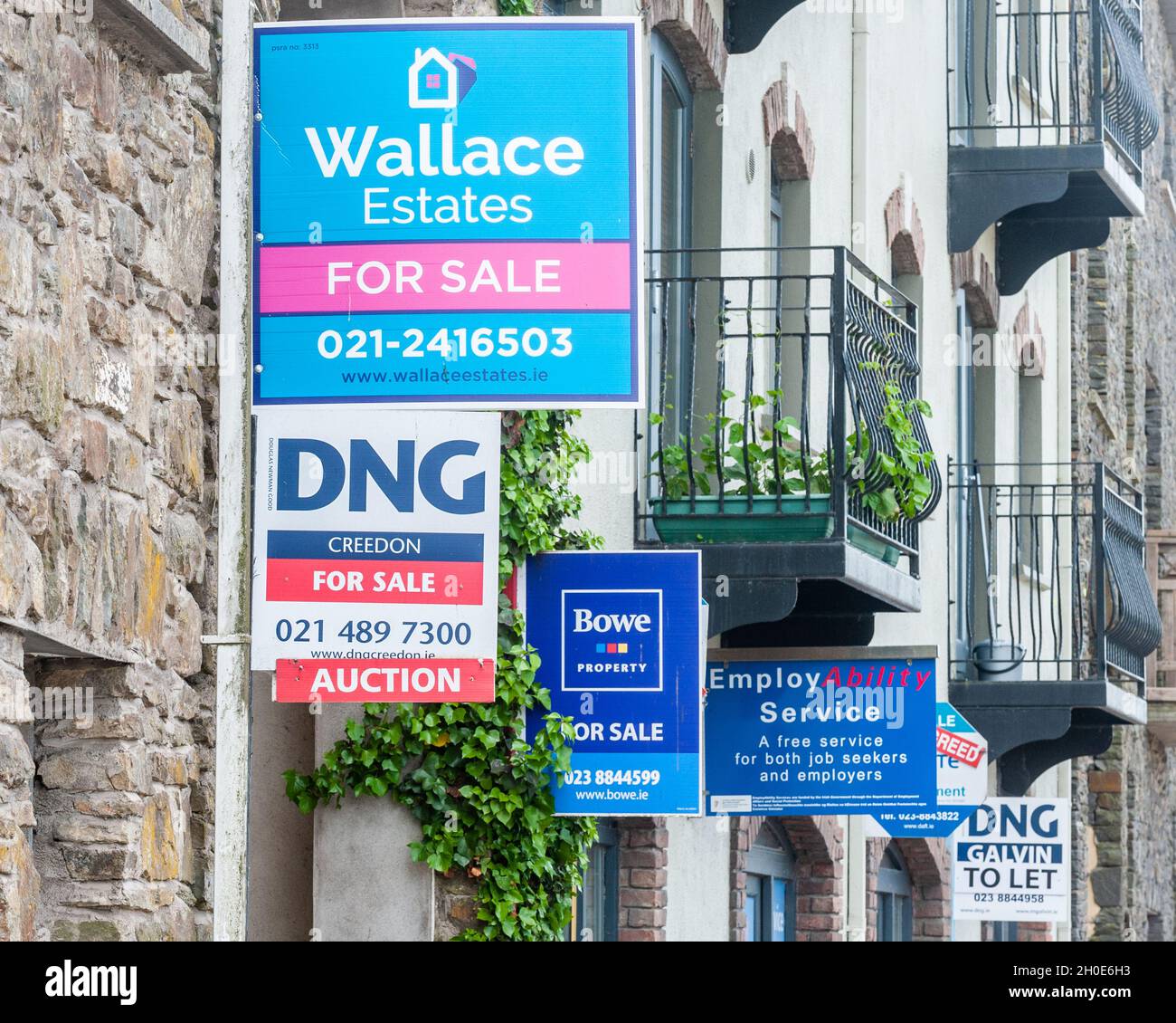 Estate agent for sale signs on exterior walls in Bandon, West Cork, Ireland Stock Photo Alamy