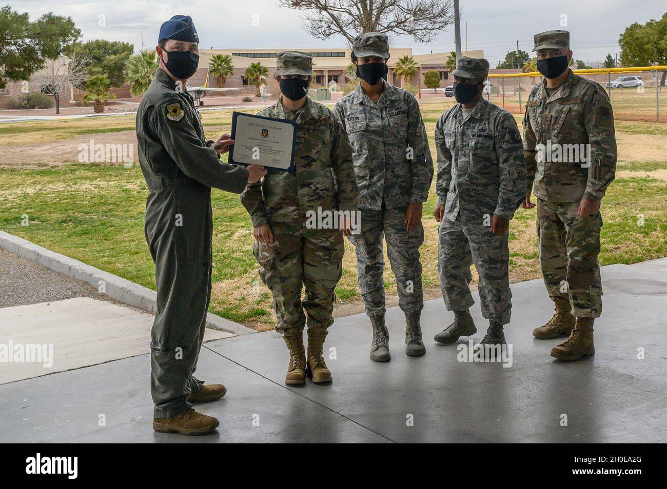 The 57th Wing Vice Commander Col. Kevin Jamieson presents the 57th ...