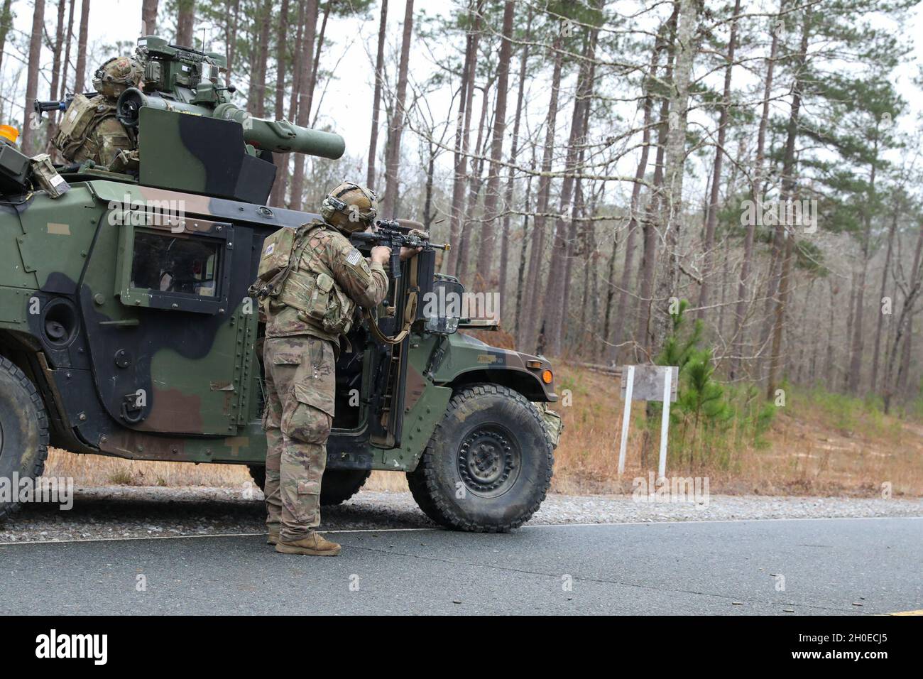 Paratroopers assigned to 5th Squadron, 73rd Cavalry Regiment, 3rd Brigade Combat Team, 82nd Airborne Division react to contact during rotation 21-04 at the Joint Readiness Training Center on Fort Polk La., Feb. 11, 2021. The rotation serves to enhance the brigade and their supporting unit's deployment readiness. Stock Photo