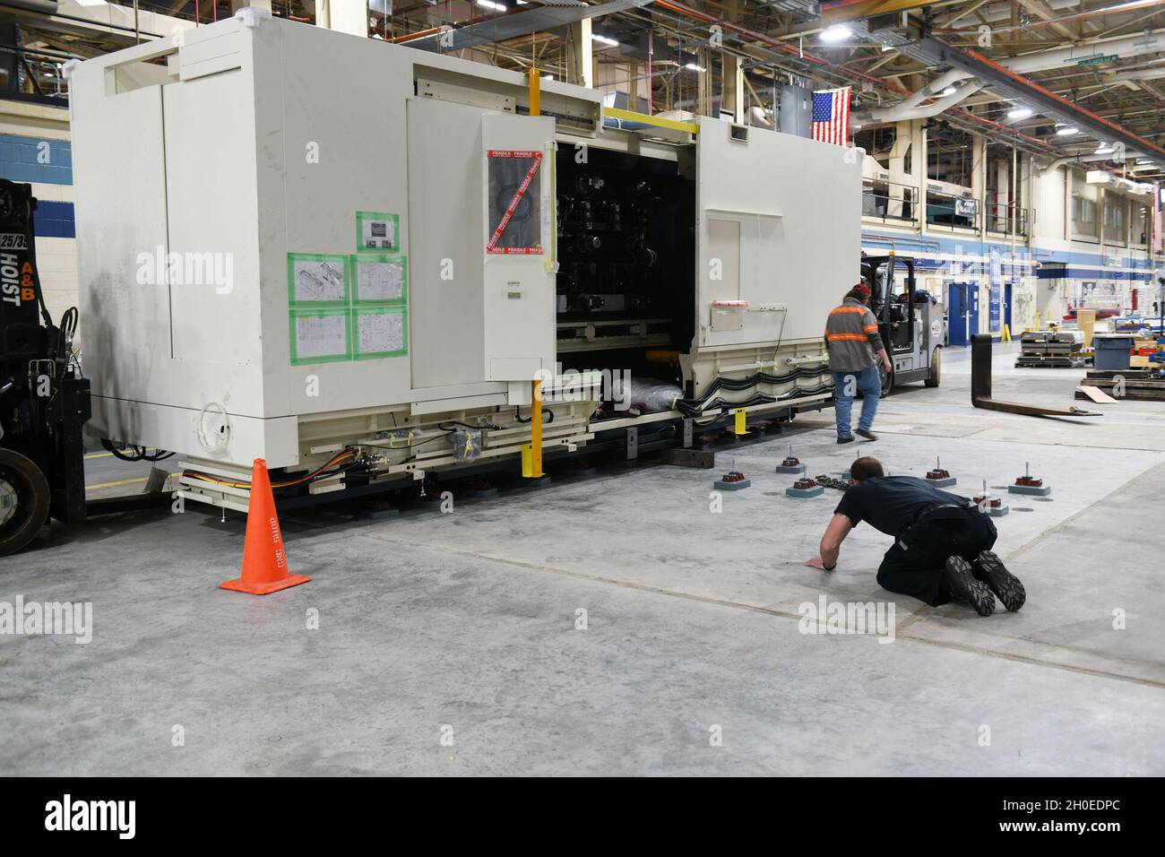 Contractors shimmy a large 5 axis computerized numerical control