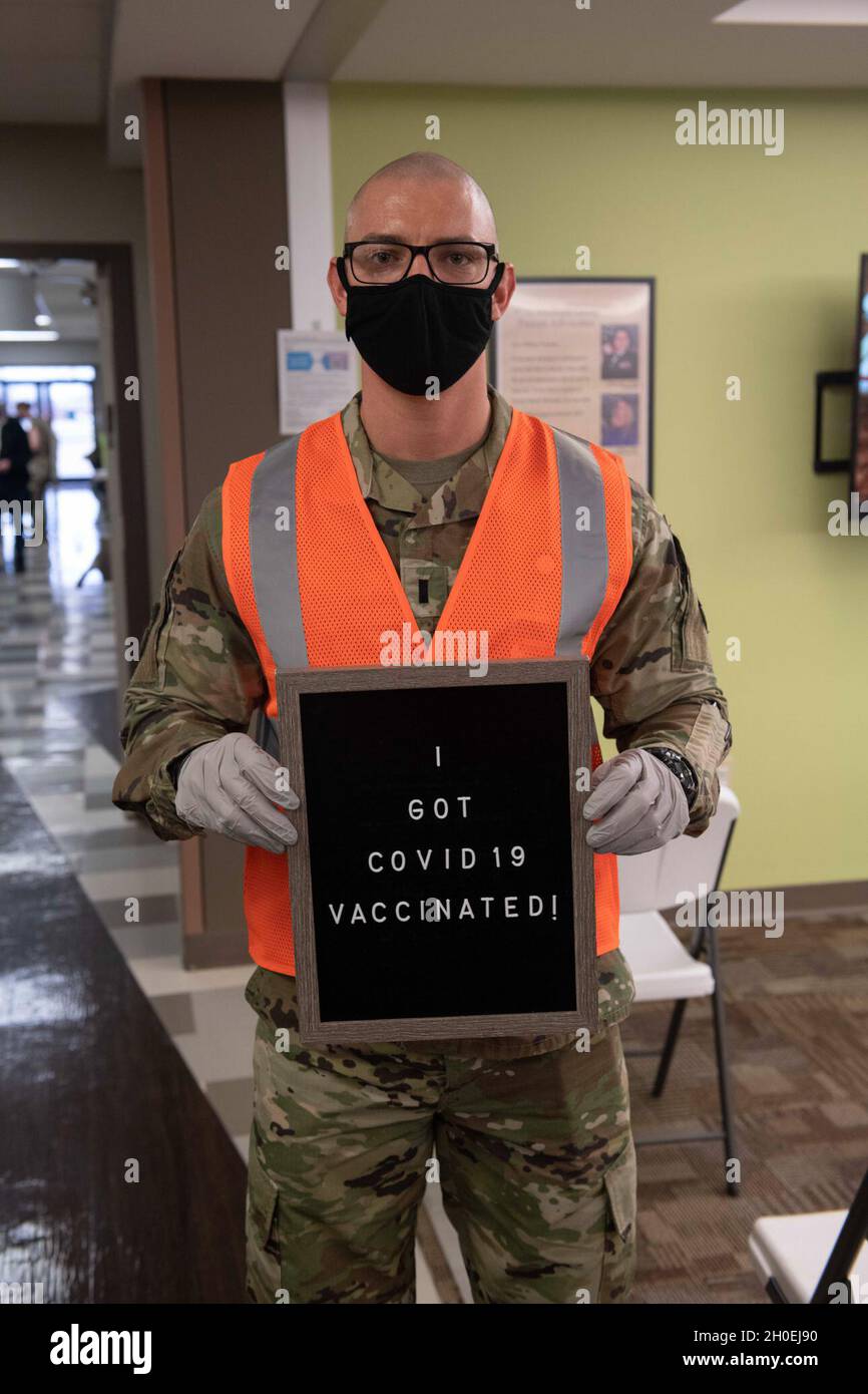 U.S. Air Force 1st Lt. Ian Roosa, 97th Medical Group medical logistics officer in charge, poses for a photo after receiving the COVID-19 vaccine, Feb. 12, 2021, at Altus Air Force Base, Oklahoma. Roosa said he volunteered for the COVID-19 vaccine because he wanted to do his part in keeping people safe. Stock Photo