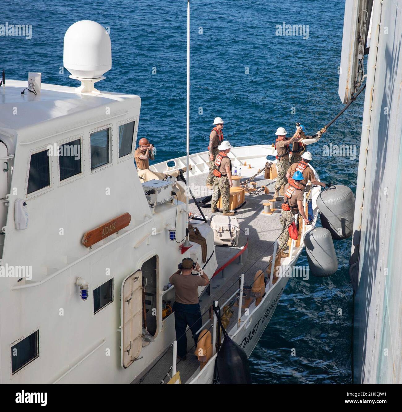 210213-n-ld903-1134-arabian-gulf-feb-13-2021-coast-guardsmen-aboard