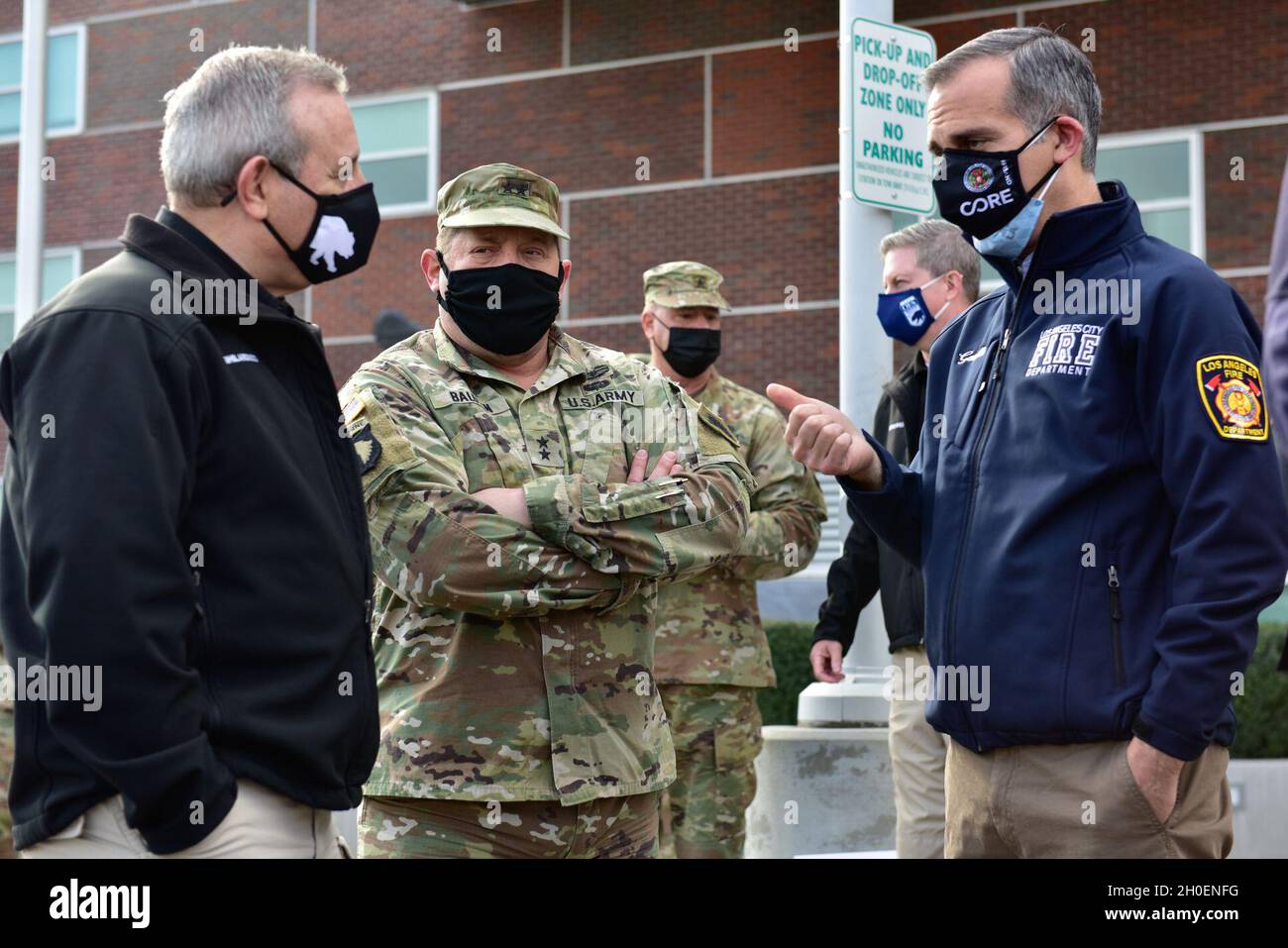 U.S. Army Maj. Gen. David Baldwin, center, the adjutant general of the  California Military Department, Mark Ghilarducci, left, director of the  California Governor's Office of Emergency Services, and Eric Garcetti,  mayor of