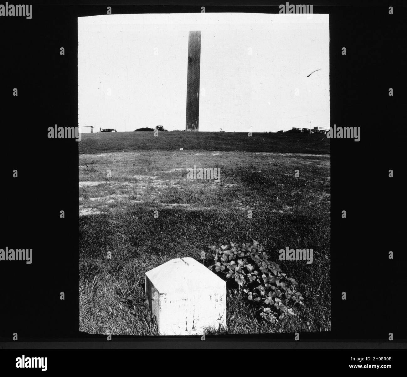 Lantern Slide 4: Jefferson Pier or Stone; erected in 1792 at the precise center of the 10-mile square. A portion of the stone was accidentally removed and the remaining portion hidden by roadwork in 1872, mostly by the filling in of the Washington Canal. The stone was recovered and re-erected December 2, 1889 and subsequently lost again. Its location was approximately 150 yards from the Washington Monument. The Capitol Stone, another historical marker, was at one time several yards south west of the Washington Monument. The difference between it and the Jefferson Stone represented half the len Stock Photo