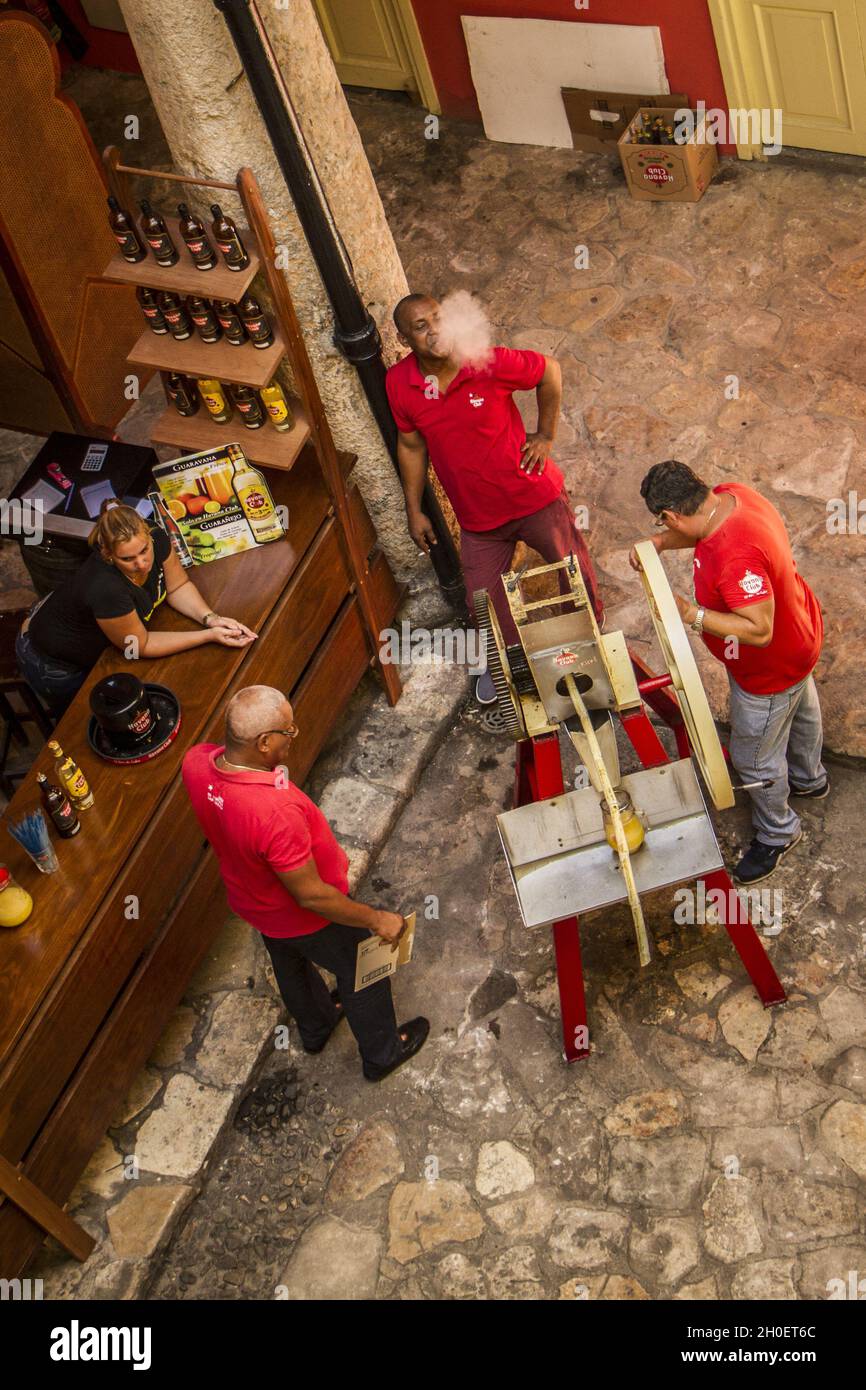HAVANA, CUBA - Jun 04, 2017: A vertical shot of people working at a bar ...