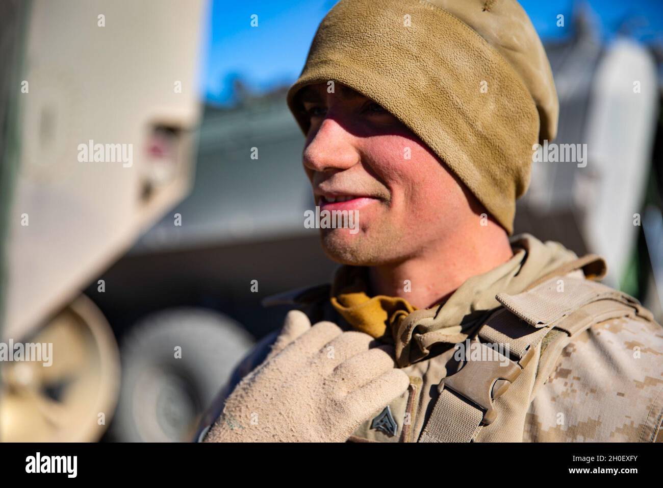 U.S. Marine Cpl. Caleb Polland, an Amphibious Combat Vehicle (ACV) crew chief with Co. D, 3rd Assault Amphibian Battalion, 1st Marine Division, poses for a photograph at the conclusion of Marine Air Ground Task Force Warfighting Exercise (MWX) 2-21 at Marine Corps Air Ground Combat Center, Twentynine Palms, Calif., February 18, 2021. MWX 2-21 was the first time ACVs were employed during a 1st Marine Division training exercise. Stock Photo