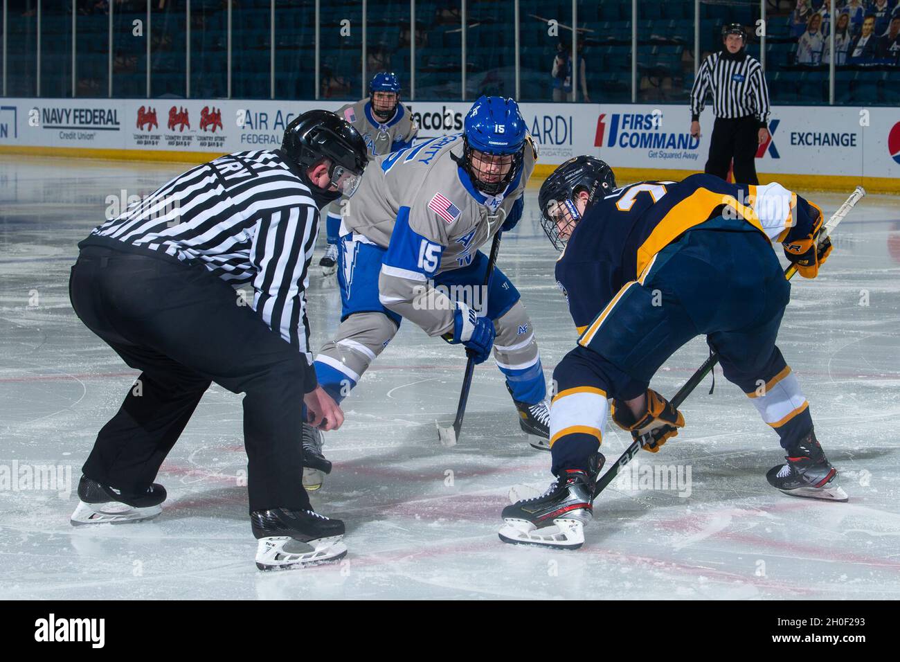 U.S. AIR FORCE ACADEMY, Colo. -- Air Force forward Bennett Norlin faces off against Canisius College forward Matt Long during a game at the Academy’s Cadet Ice Arena, Feb. 19, 2021. Air Force defeated Canisius 4-3. Stock Photo