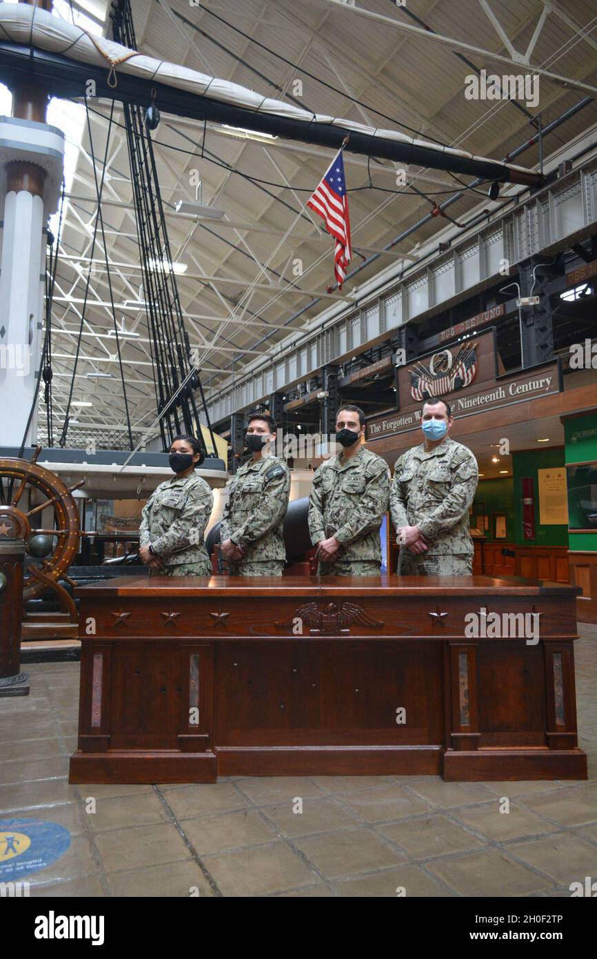 Seabees pose with the executive desks they constructed for the Vice