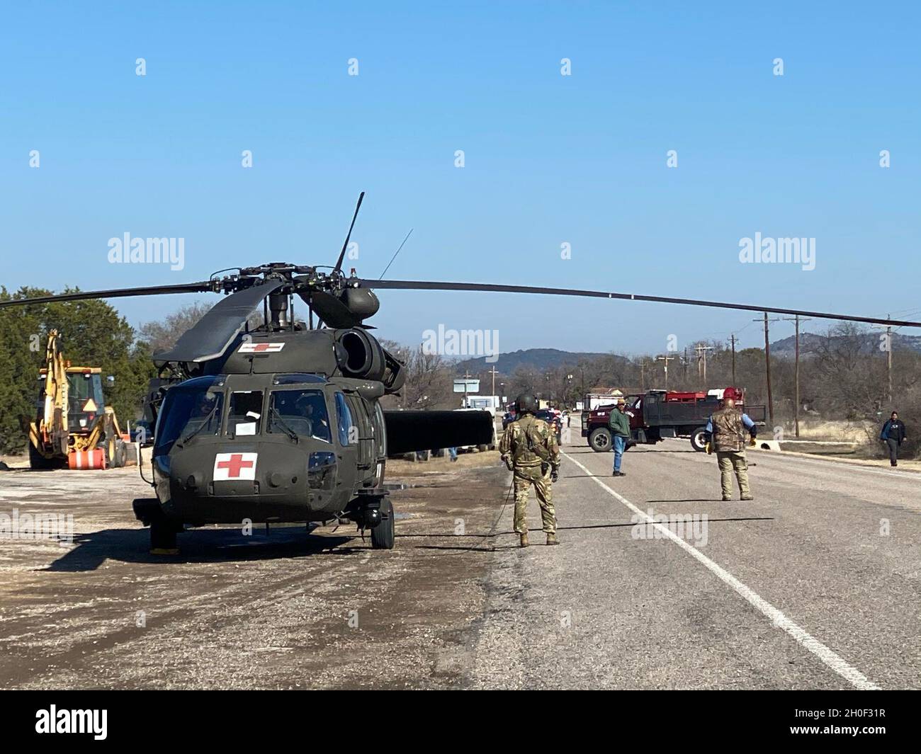Soldiers of Charlie Company, 2-149th General Aviation Support Battalion, Texas Army National Guard deliver food and water in response to Winter Storm Uri Feb 20. 2021, at Camp Wood, Texas. Stock Photo