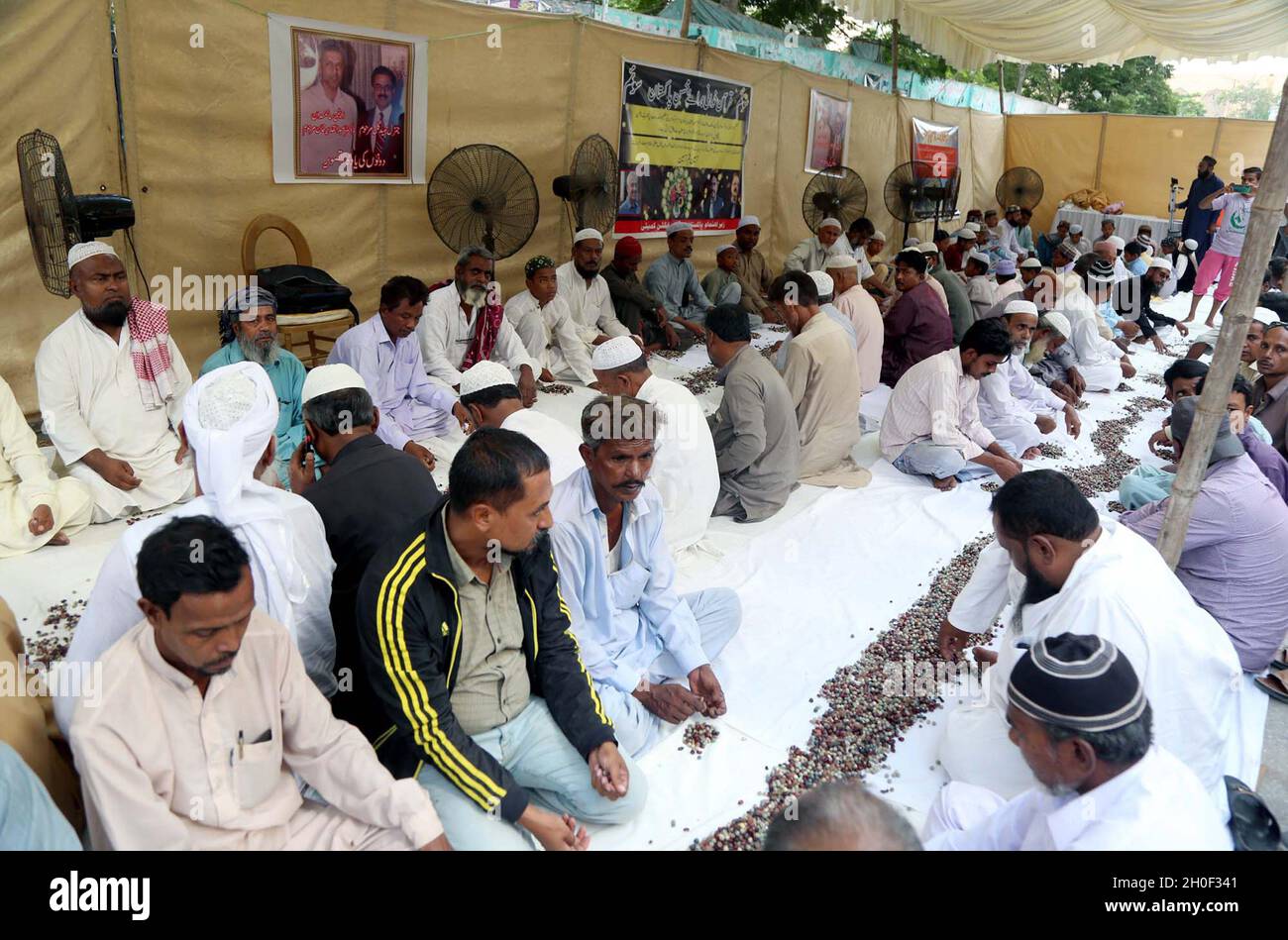 Hyderabad, Pakistan, October 12, 2021. Leaders and activists of Bengali Action Committee reciting Holy Quran and Fateha for the soul of Nuclear Scientist, Dr. Abdul Qadeer Khan who passed away in Islamabad, during condolence ceremony held at Karachi on Tuesday, October 12, 2021. Stock Photo