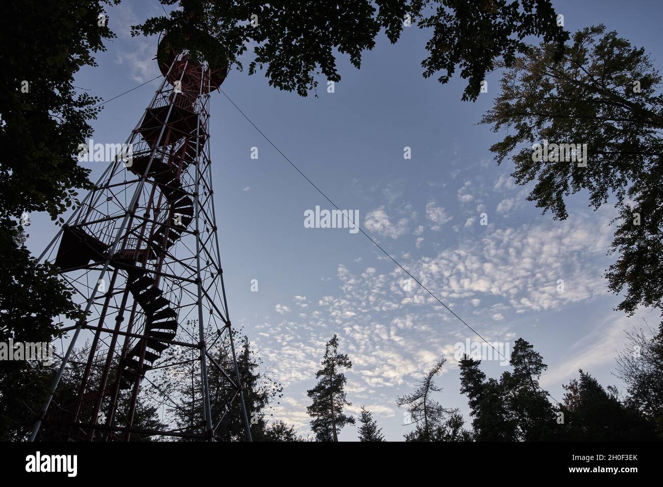 Silhouette of Büchenbronn observation tower with winding staircase framed by trees in Pforzheim, Germany. Stock Photo