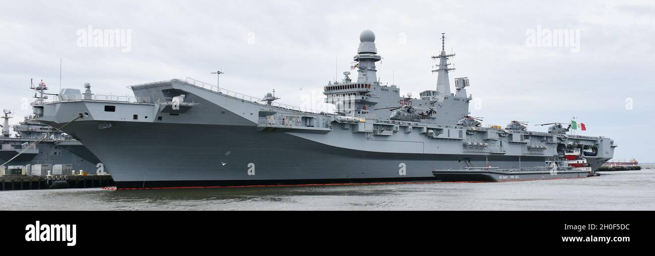 The NAVSUP FLC Norfolk refueling barge YON 323 pumps F76 fuel to the Italian Aircraft Carrier