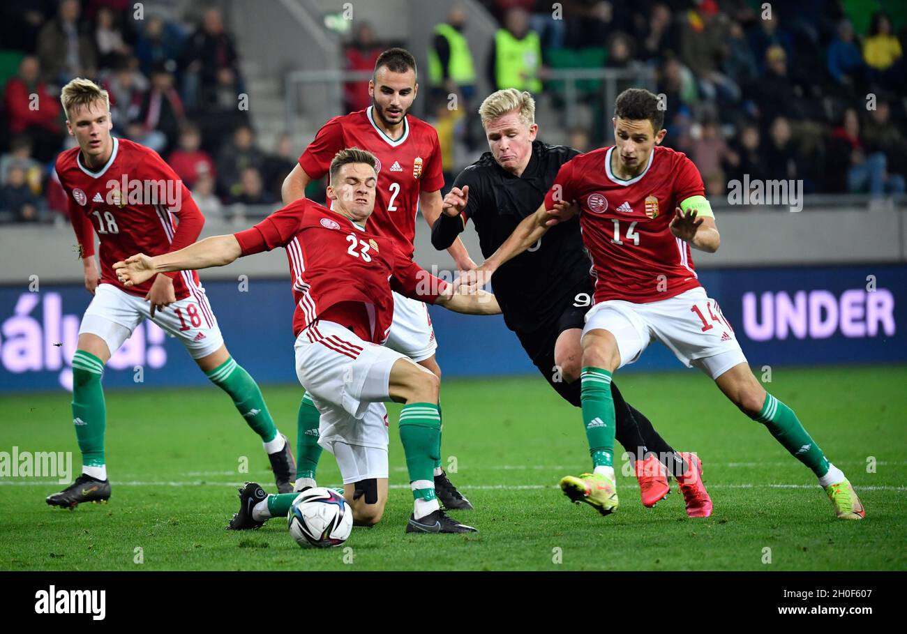 Szeged, Hungary. 12th Oct, 2021. Football: U21, European Championship  qualification, Hungary - Germany at the Szent Gellert Forum. Germany's  striker Jonathan Burkardt (2nd from right) fights for the ball between  Hungary's Norbert