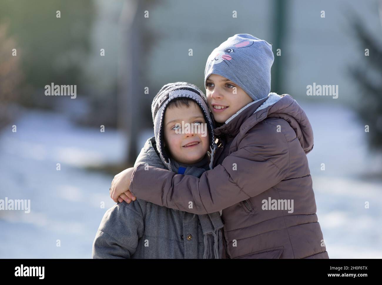 Portrait Of Sister And Brother Hugging In The Park High Resolution ...