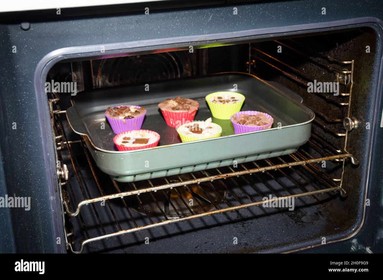 muffin in colorful shapes in the oven Stock Photo Alamy