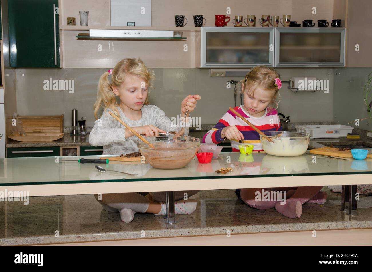 Two Kids Preparing Sweet Muffins In The Kitchen Stock Photo Alamy two-kids-preparing-sweet-muffins-in-the-kitchen-stock-photo-alamy