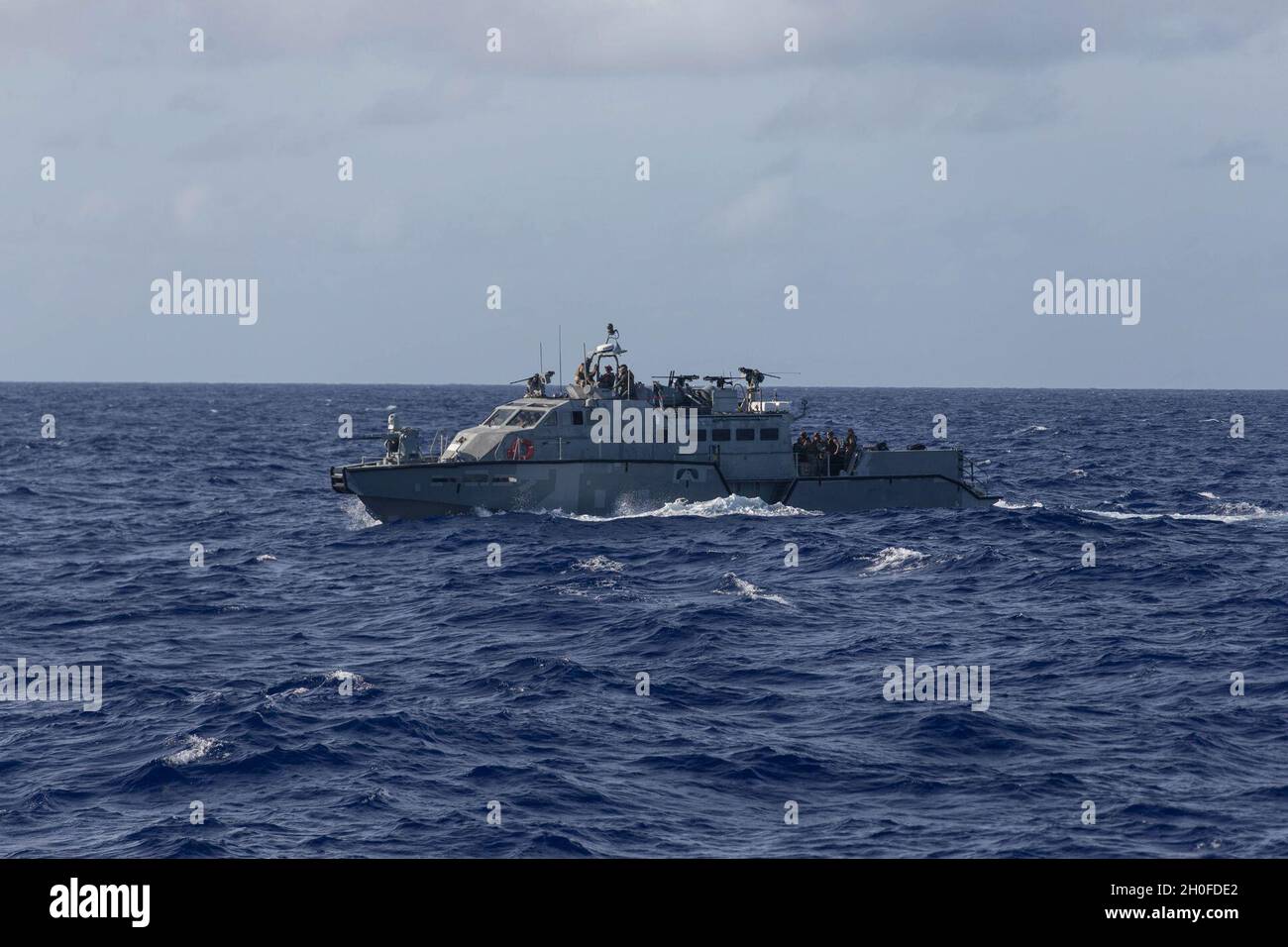 A U.S. Navy Mark VI patrol boat with Maritime Expeditionary Security Squadron Two navigates through water during an onload exercise aboard dock landing ship USS Ashland (LSD 48) in the Philippine Sea, Feb . 24, 2021. The 31st MEU is operating aboard the ships of the Amphibious Squadron 11 in the 7th fleet area of operations to enhance interoperability with allies and partners and serve as a ready response force to defend peace and stability in the Indo-Pacific Region. Stock Photo