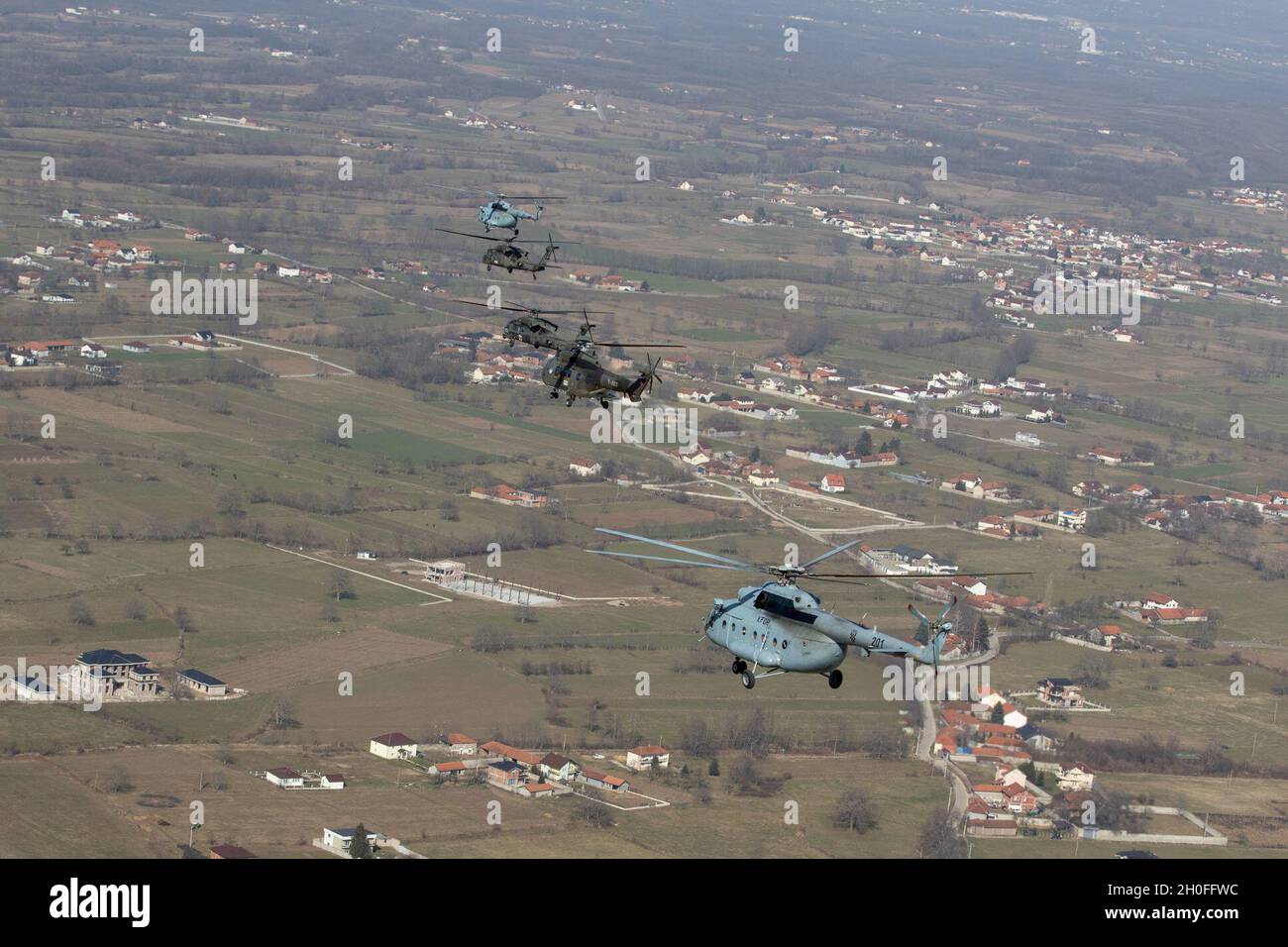 Helicopters from Croatia, Switzerland and the United States fly in formation during a multi-aircraft exercise on Feb. 25, 2021. The exercise included six helicopters to understand flight procedures and enhance interoperability to strengthen KFOR’s ability to respond to any threat in Kosovo. (Army Stock Photo