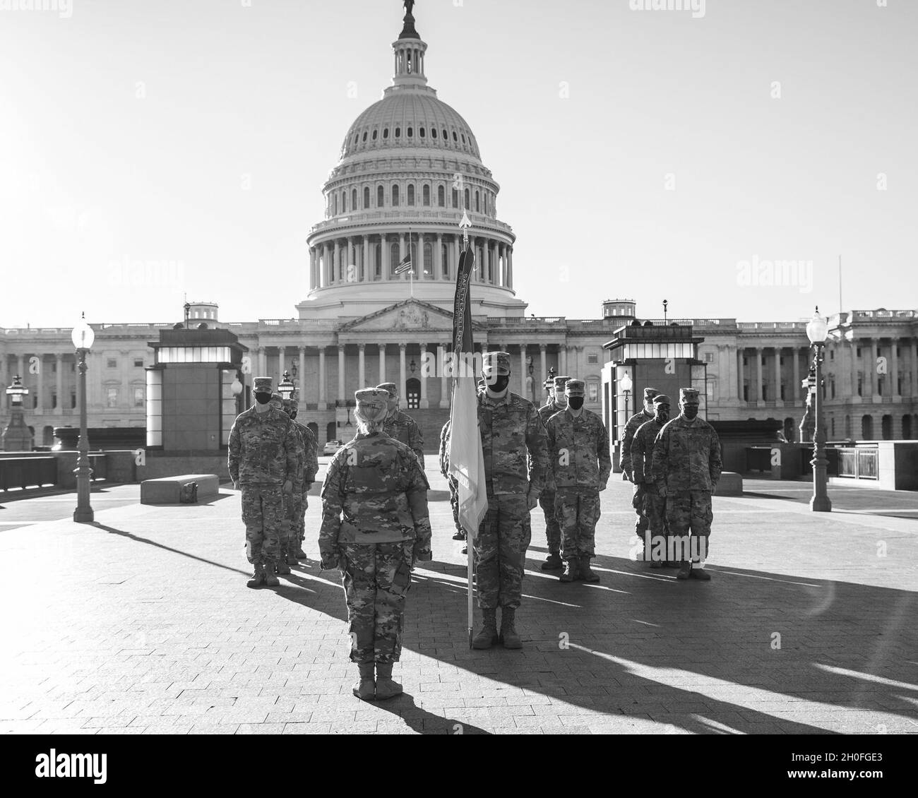 U.S. Soldiers with the 177th Military Police Brigade, Michigan National Guard, stand in formation during an award ceremony at the U.S. Capitol in Washington, D.C., Feb. 25, 2021. The National Guard has been requested to continue supporting federal law enforcement agencies with security, communications, medical evacuation, logistics, and safety support to state, district and federal agencies through mid-March. Stock Photo