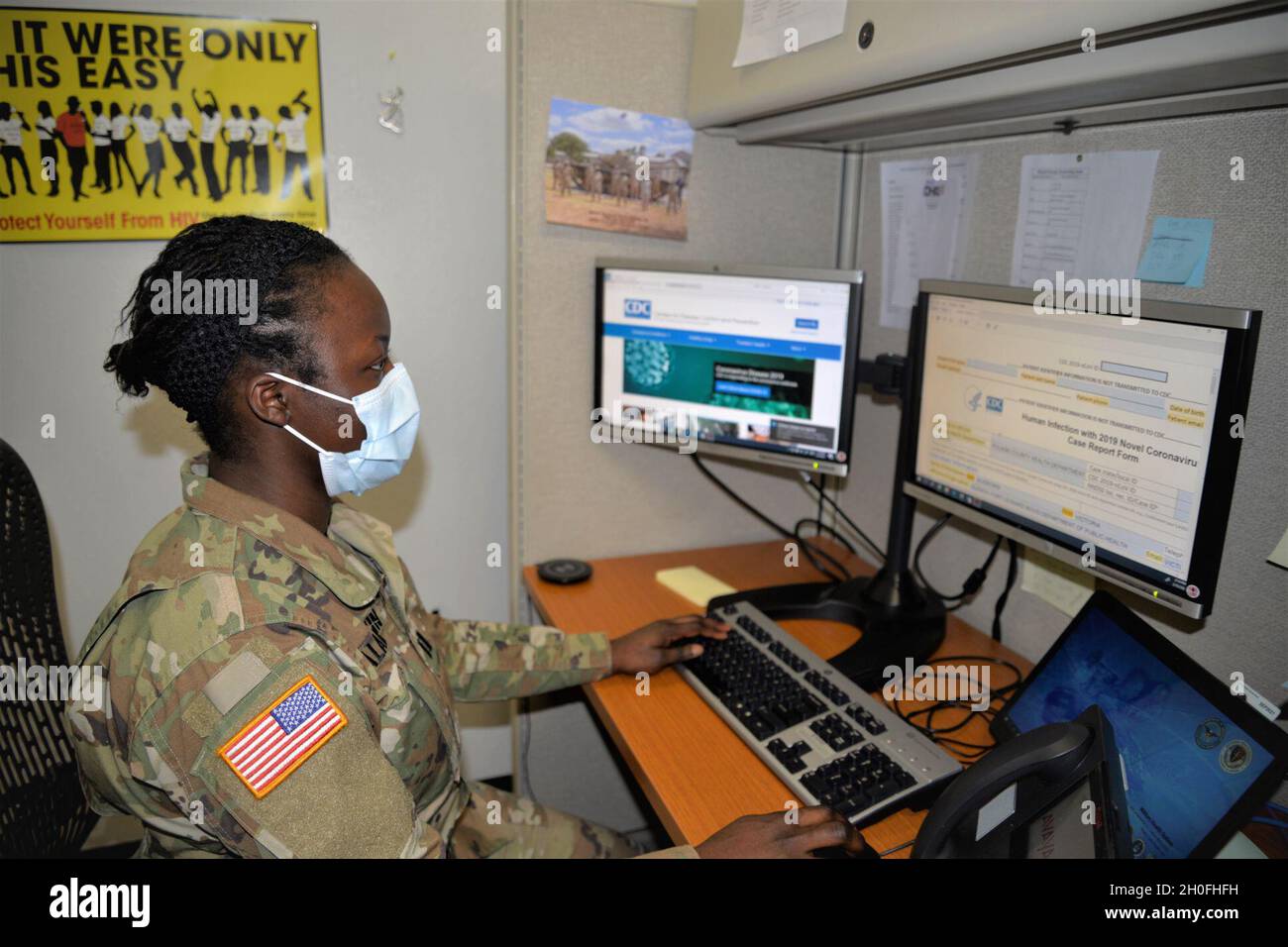 Capt. Victoria Aladeokin glances at a contact tracing form during her duties as an Army Public Health Nurse on Fort Leonard Wood, Missouri Feb. 25. Stock Photo