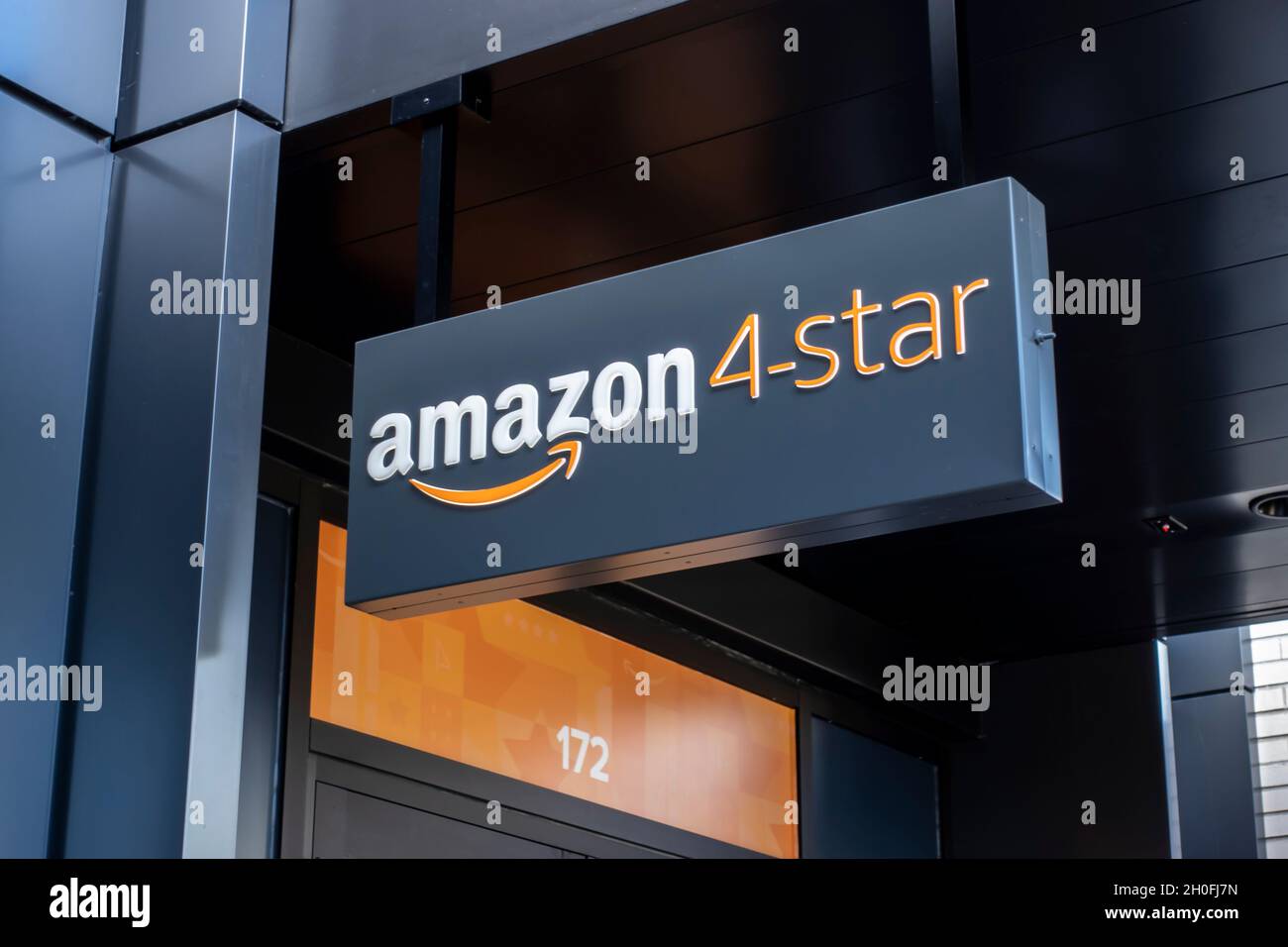Kirkland, WA USA - circa September 2021: Low angle view of the entrance to an Amazon 4 Star store in Totem Lake. Stock Photo