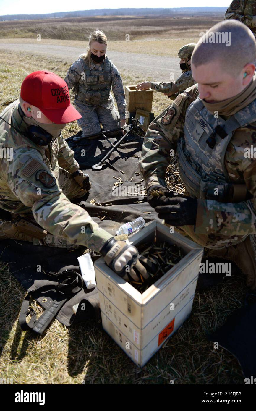 U.S. Air Force 88th Security Forces Squadron defenders retrieve bullet ...