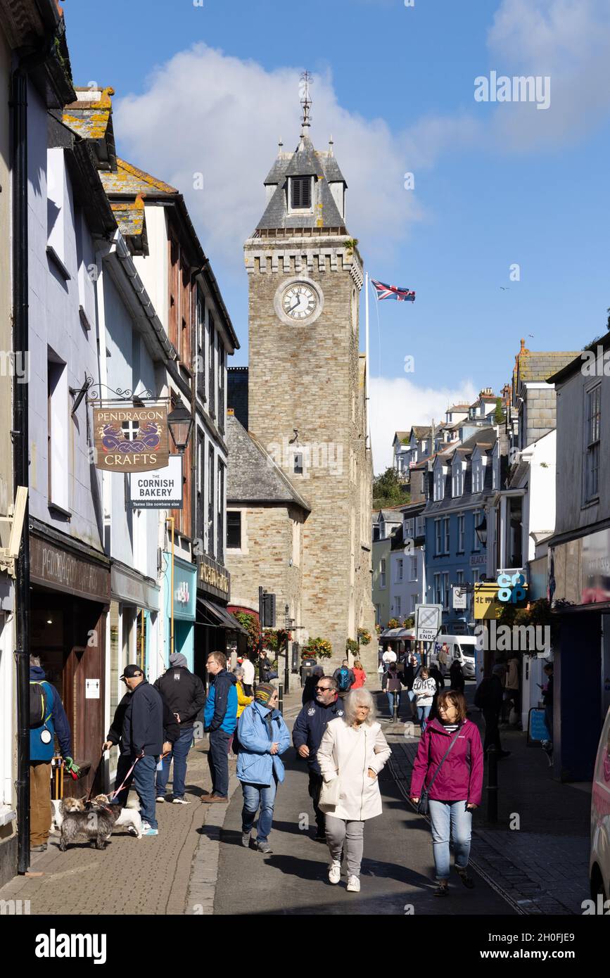 Cornwall street scene; crowds of people on Fore street on a sunny summer day, Looe, Cornwall UK Stock Photo