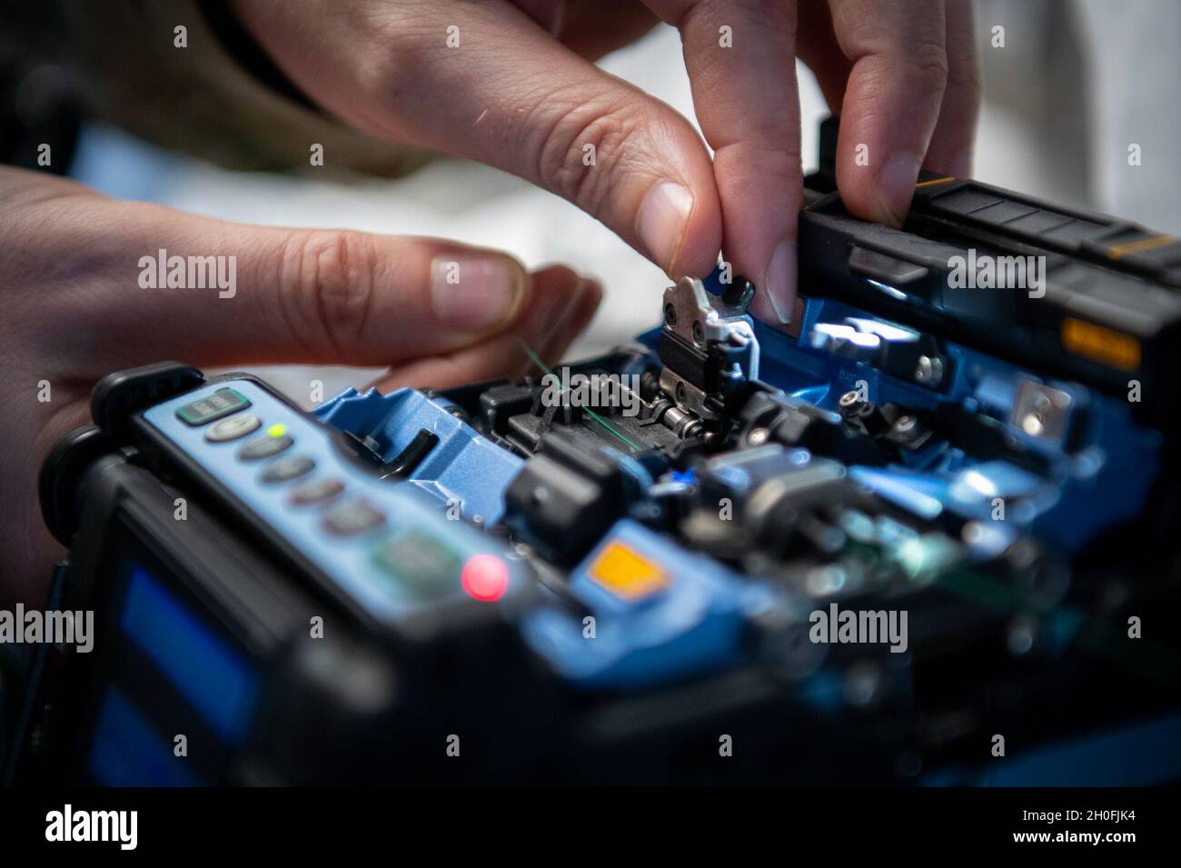 Tech sgt brian george 96th communications squadron places a cable