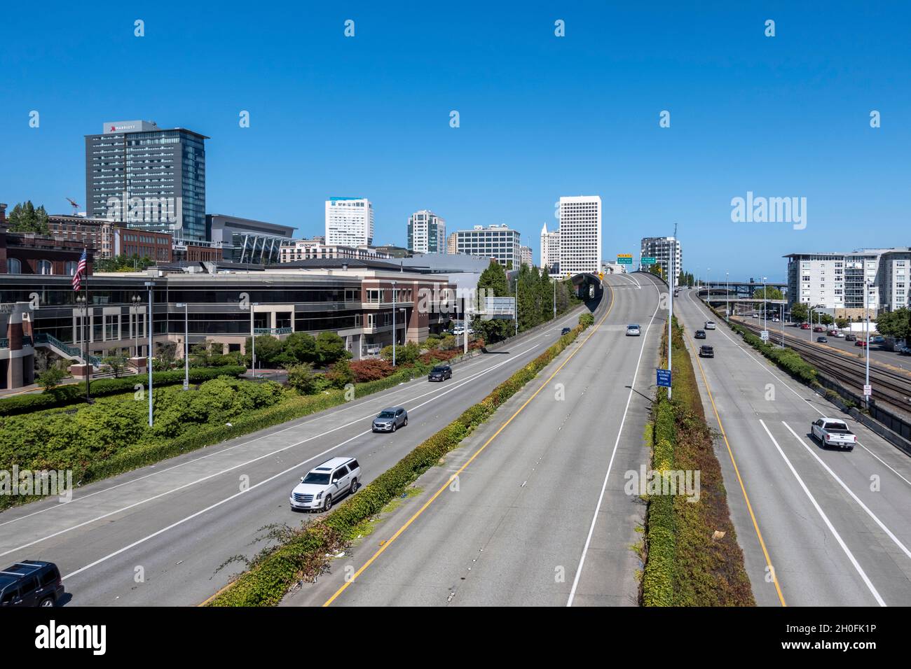 Tacoma, WA USA - circa August 2021: Aerial view of downtown Tacoma's highway traffic on a bright, sunny day. Stock Photo