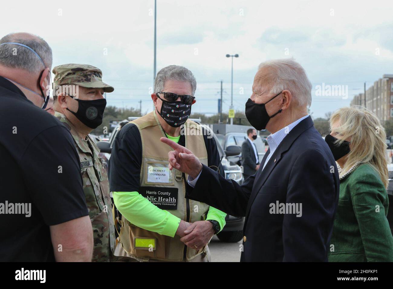 President Joseph Biden asks about the Department of Defense personnel under the command of U.S. Army Maj. Gen. Pablo Estrada, Commanding General, Task Force 46, during the President’s visit to the state-run, federally-supported COVID-19 Community Vaccination Center at NRG Stadium in Houston, Texas, Feb. 26, 2021.  During his visit, the President met with the Airmen and Soldiers who support Harris County, State of Texas, and Federal Emergency Management Agency efforts to vaccinate the public for COVID-19.  U.S. Northern Command, through U.S. Army North, remains committed to providing continued, Stock Photo