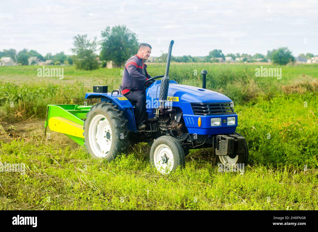 Kherson oblast, Ukraine - September 19, 2020: A farmer on a tractor ...
