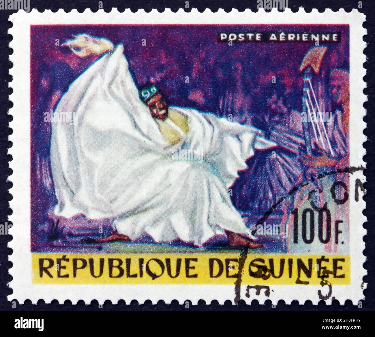 GUINEA - CIRCA 1966: a stamp printed in Guinea shows Kouyate Kandia, National Singer, circa 1966 Stock Photo