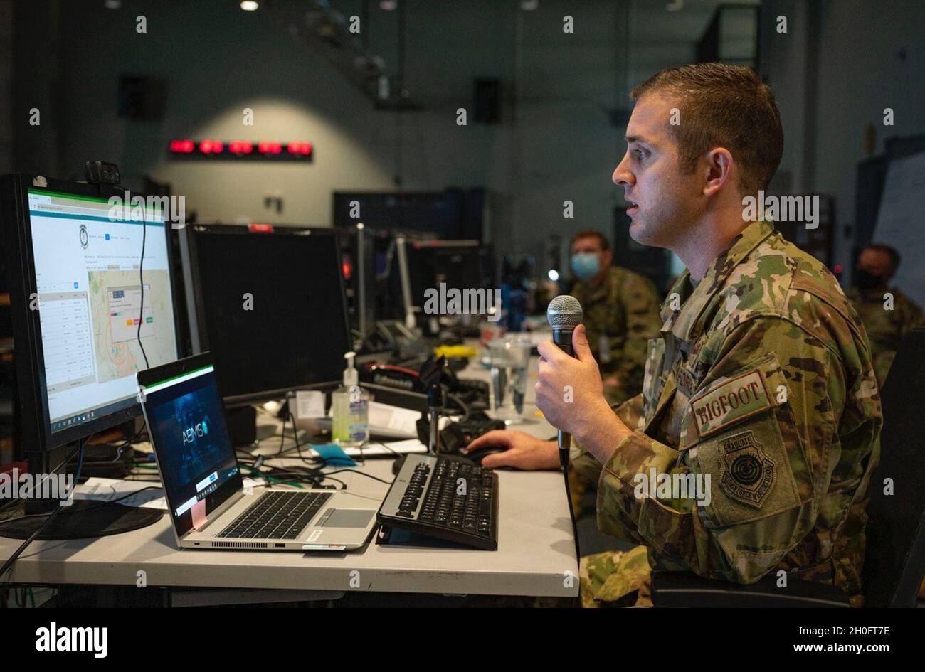 U.S. Air Force Maj. Nicholas Detloff, Course of Action Management product line manager from the 225th Air Defense Squadron, Washington Air National Guard, briefs fellow warfighters on the capabilities of the Advanced Battle Management System (ABMS) at the Shadow Operations Center at Nellis (ShOC-N), Nevada, Feb. 26, 2021. The ShOC-N is contributing to the development of ABMS via DevSecOps. Stock Photo