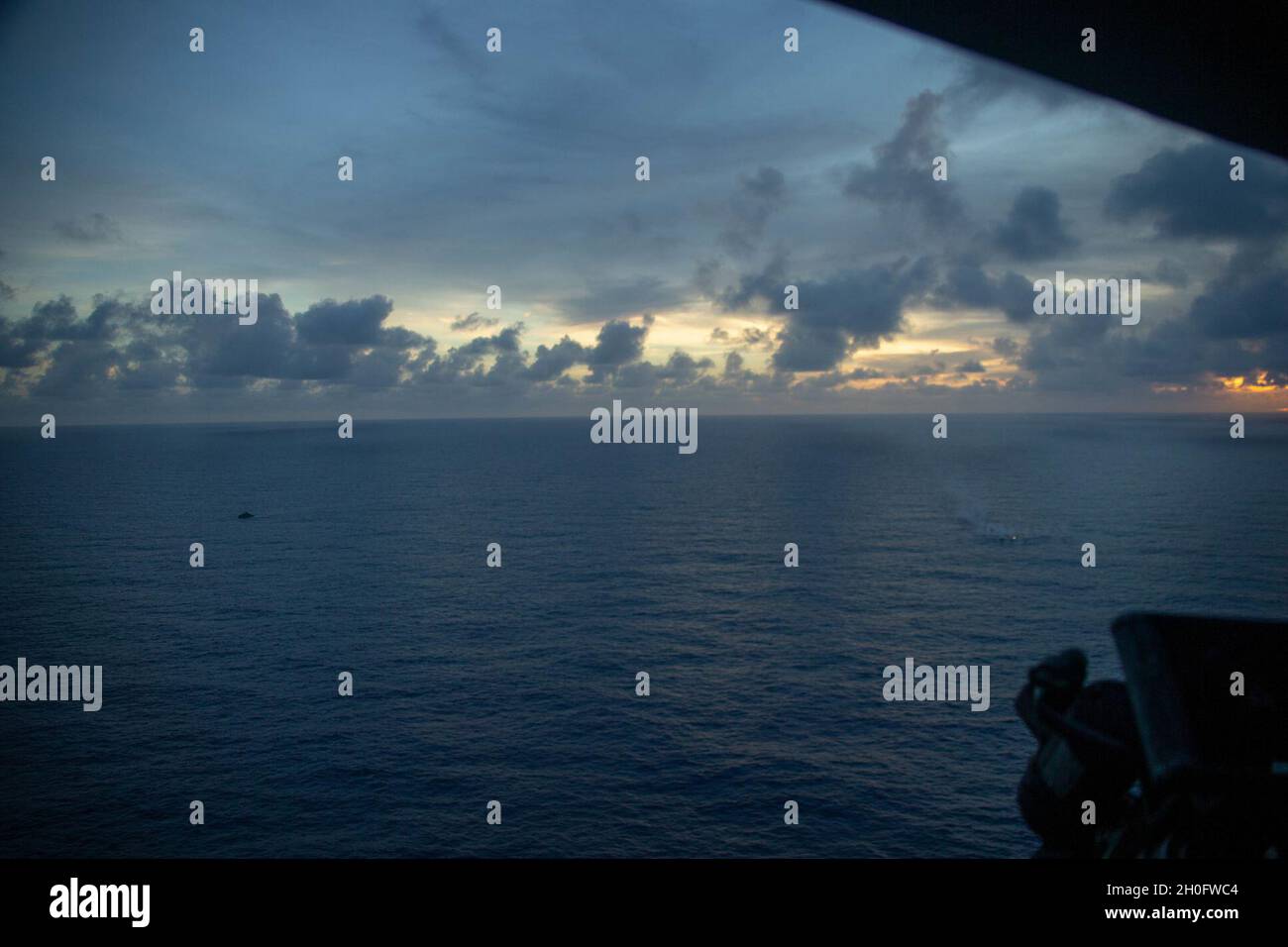 U.S. Marines with 2nd Low Altitude Air Defense Battalion and Marine Medium Tiltrotor Squadron (VMM) 262 (Reinforced), 31st Marine Expeditionary Unit (MEU), conduct a combined attack from a U.S. Navy Mark VI patrol boat with Maritime Expeditionary Security Squadron TWO and aircraft from VMM-262 REIN during a live fire exercise in the Philippine Sea, Feb. 27, 2021. The exercise was conducted to test the effectiveness of firing various weapon systems at sea from smaller, more expeditionary platforms than are traditionally used. The 31st MEU is operating aboard ships of the Amphibious Squadron 11 Stock Photo