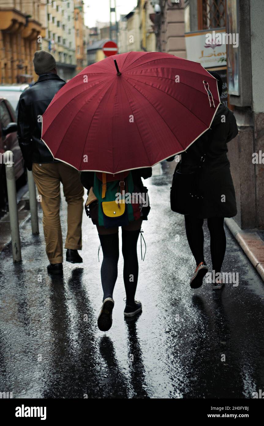 Big red umbrella in Budapest on a rainy day, Hungary Stock Photo