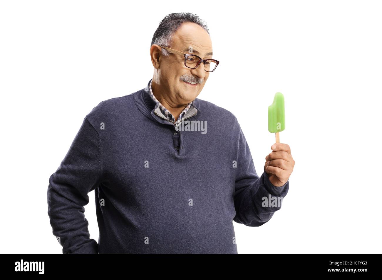 Happy mature man holding an ice lolly isolated on white background Stock Photo